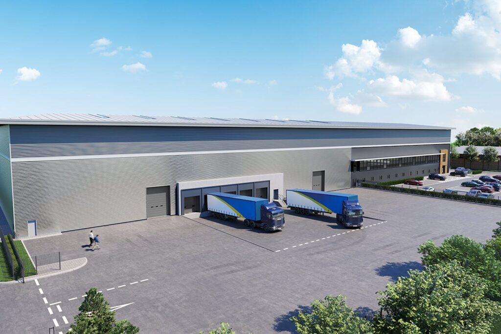 Large warehouse with two HGV lorries waiting to be loaded